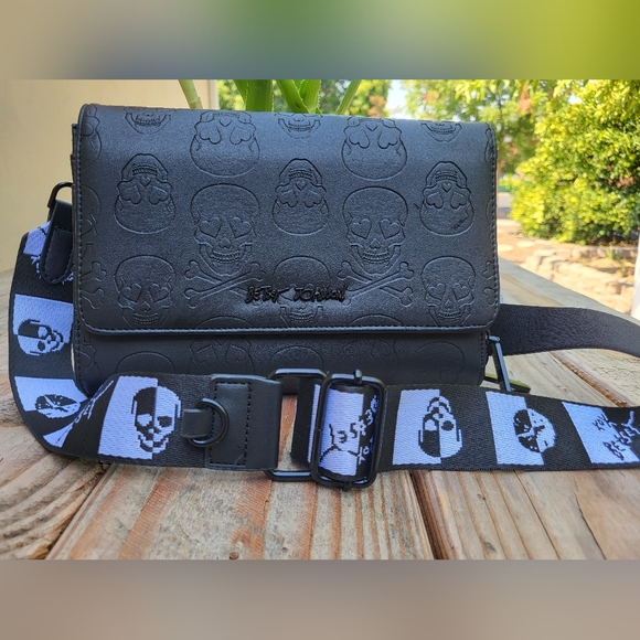 Betsey Johnson Handbags - Betsey Johnson Black Embossed Skulls Crossbody Bag XOLANDON